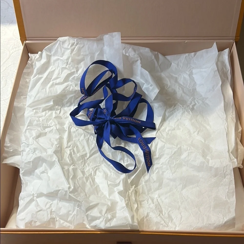 Louis Vuitton Signature  Box inside a LV shipping box with tissue and ribbon.